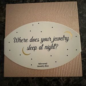 Brand new jewelry box with mirror.  Color is peach.